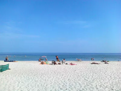 Limits of credit cards international travel insurance : Beach day in Poland on the Baltic sea