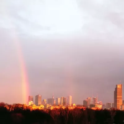 7 Ways To Move As A Foreigner To Poland : Rainbow of Warsaw skyline as seen from Wola district
