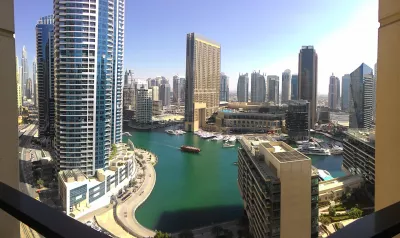 How to get free hotel nights – choose a reward program : Balcony view on Dubai marina from the Ramada Plara Jumeirah Beach Dubai hotel, with free Wyndham Rewards program reward nights