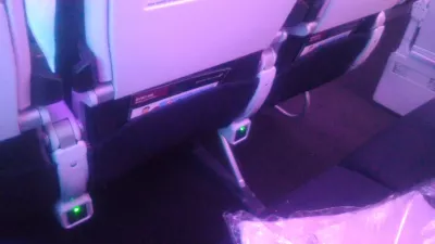 Air New Zealand planes inside flight review : Power plug under seat in front