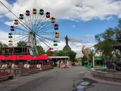 Flying To Yerevan, Armenia: Tips And Tricks : Theme park with ferris wheel and other attractions in Victory Square