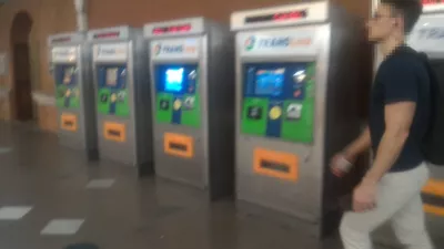 What are the tourist and free public transport in Brisbane? : Train ticket machines at Brisbane Central station