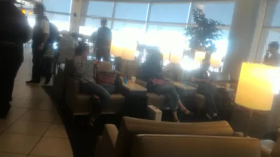 How to get access to United lounge LAS, and how is it? : Busy seating area