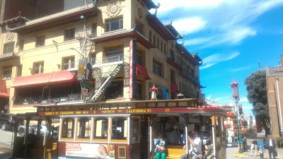 How is the San Francisco public transportation system? : A cable car passing in Chinatown