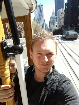 How is the San Francisco public transportation system? : Selfie while riding the cable car