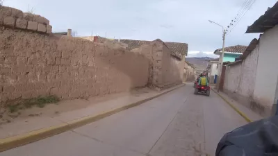 Should You Go For An ATV Tour Cusco Quading In 1 Day? Yes! : Driving a quad bike in a Peruvian village