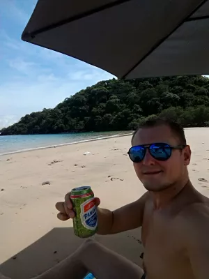 How is a Beach day trip to Taboga island, Panama? : Having a beer under the sun on Taboga beach