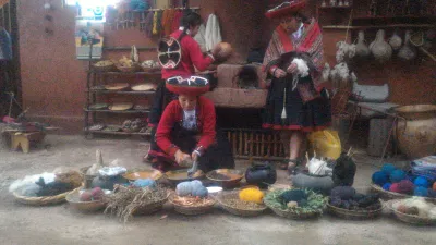 How Is The Sacred Valley Peru 1 Day Trip? : Ladies in traditional costume coloring textile