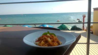 Zaliznyy port iron port holidays : Lunch with black sea sunny beach view