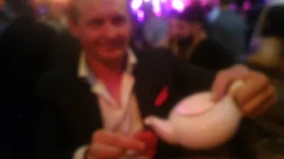 Fun things to do in Auckland at night: the Auckland's Frenzi Barcrawl : Blurry picture drinking teapot specialty in busy bar