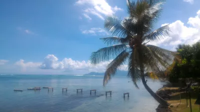 What are the best beaches in Tahiti? : View on Moorea and coconut tree from Ia Ora Sofitel