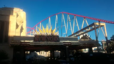 Walking on the best parts of Las Vegas strip up to the neon museum : New York New York hotel entrance and its BigApple roller coaster