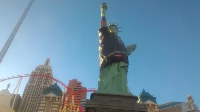 Walking on the best parts of Las Vegas strip up to the neon museum : Statue of liberty and Big Apple roller coaster in New York New York hotel