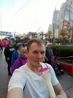 Walking on the best parts of Las Vegas strip up to the neon museum : Sipping a Fat Tuesday drink in the street