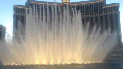 Walking on the best parts of Las Vegas strip up to the neon museum : Fountains show in front of Bellagio