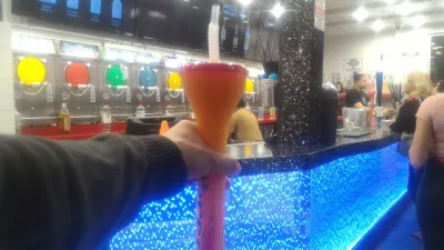 Walking on the best parts of Las Vegas strip up to the neon museum : Fat Tuesday mango and passion fruit street drink