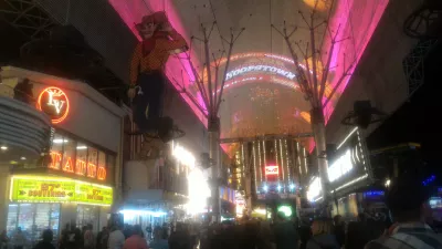 Walking on the best parts of Las Vegas strip up to the neon museum : Fremont street experience and its zip line above the busy walking street