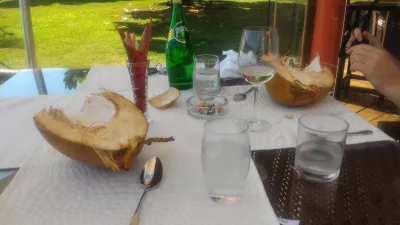 What to eat in Tahiti in the middle of the Pacific ocean? : Coconut freshly taken off a nearby tree graciously opened and offered at Tahiti Ia Ora beach resort managed by Sofitel