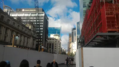 Joining the only free walking tour Auckland : Going towards high rise buildings