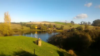 Hobbiton movie set tour, a visit of the hobbit village in New Zealand : View on the Green Dragon Inn