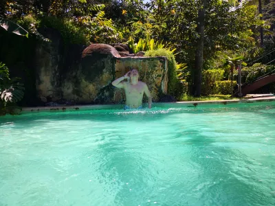 How is the longest swimming pool in Polynesia? : Relaxing under a water fountain at Carlton Plage residence pool