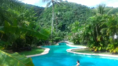 How is the longest swimming pool in Polynesia? : View on the whole pool under the sun and Tahiti's luxurious vegetation