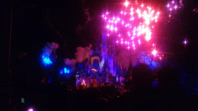 How is a one day visit at Disney's Magic Kingdom? : Fireworks display show at night on top of Cinderella's castle