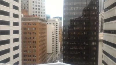 How is the San Francisco secrets, scandals and scoundrels free walking tour? : View on high rise buildings and street from a hidden terrace