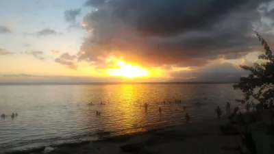 Beautiful sunset images on Tahiti best beach : Yellow sunset in Tahiti over Moorea island free stock photos