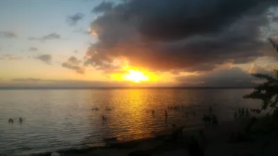 Beautiful sunset images on Tahiti best beach : Yellow sunset in Tahiti over Moorea island free images download