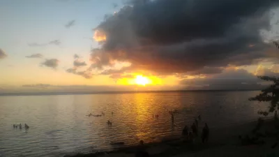 Beautiful sunset images on Tahiti best beach : Yellow sunset in Tahiti over Moorea island free images download