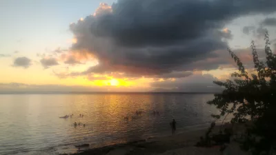 Beautiful sunset images on Tahiti best beach : Yellow sunset in Tahiti over Moorea island free stock photos
