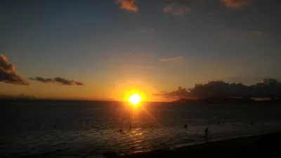 Beautiful sunset images on Tahiti best beach : Orange sunset in Tahiti over Moorea island free stock photos