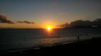 Beautiful sunset images on Tahiti best beach : Orange sunset in Tahiti over Moorea island free images download