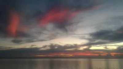 Beautiful sunset images on Tahiti best beach : Red sunset in Tahiti over Moorea island free stock photos