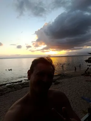Beautiful sunset images on Tahiti best beach : Selfie while watching amazing sunsets over Moorea