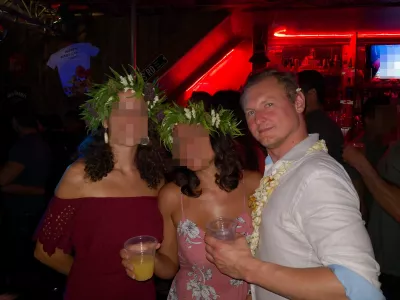 Tahiti nightlife, what to do in Tahiti at night? : With local Tahitian girls at a party in Morrison's Café wearing flowers necklace for men and floral crowns for girls