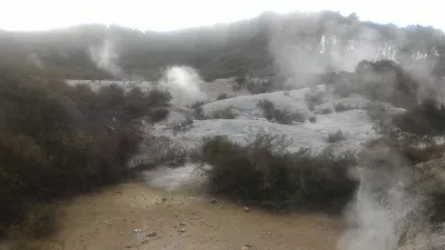 A visit of Wai-O-Tapu thermal wonderland and Lady Knox geyser : Steam going out of the ground
