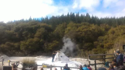 A visit of Wai-O-Tapu thermal wonderland and Lady Knox geyser : Employee starting the Lady Knox geyser reaction
