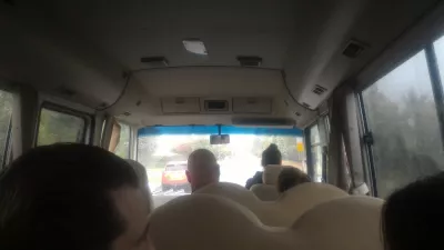 Extreme white water rafting in Rotorua, New Zealand: down a 7 meters waterfall! : Inside the transfer bus to the Kaitiaki Adventures camp